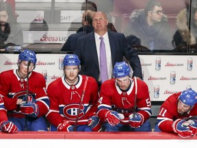 Montreal Canadiens coach Claude Julien watches the last couple of seconds of a losing effort against the San Jose Sharks in Montreal on Jan. 2, 2018. Julien is standing behind Artturi Lehkonen, left, Jonathan Drouin, Charles Hudon and Brendan Gallagher.