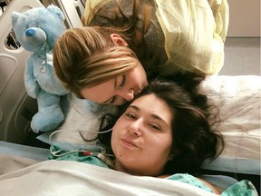 Samantha Mongeon kisses her sister, Sabryna, after a serious car accident on Christmas Eve.