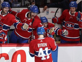Canadiens' Paul Byron is congratulated by teammates Phillip Danault (24), Max Pacioretty (67), Tomas Plekanec (14) and Andrew Shaw (65), after scoring winning goal during shootout Thursday night at the Bell Centre.