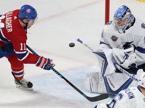 Brendan Gallagher assumes his usual position — driving at the net — as me moves in on Lightning goalie Andrei Vasilevskiy during second-period action at the Bell Centre Thursday night.
