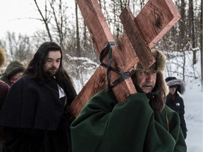Montrealers engage in a walk on Saturday, Jan. 6, 2018, to commemorate the 375th anniversary of Paul de Chomedey, Sieur de Maisonneuve’s raising of the cross on Mount Royal. The cross was erected on Jan. 6, 1643, in gratitude for Ville-Marie having been spared the threat of flooding on Christmas Eve.