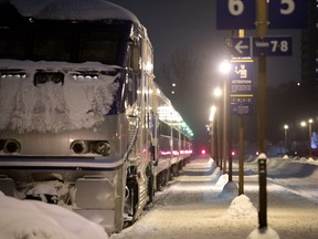 An RTM commuter train sits in the Lucien-L'Allier station in Montreal on Monday January 8, 2018. Early in the day delays had been reported due to snow clogged switching stations on the tracks.