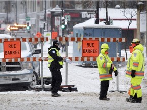 Ste-Catherine St. is closed to traffic at the corner of Robert-Bourassa Blvd. in Montreal.