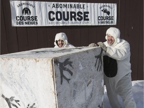 Dressed up in furry Yeti suits Charles Bedard (left) and Marc Bedard, roll giant die. Marc and his son are organizing the Abominable Snow Course in January, and rolling a pair of dice will be part of the event.