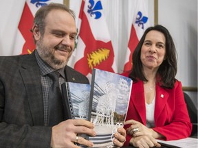 Montreal Mayor Valerie Plante and executive committee chairman Benoit Dorais present copies of the city's budget Jan. 10, 2018.