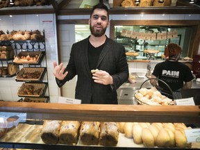Laurent Duvernay-Tardif, offensive lineman for the Kansas City Chiefs, behind the counter at his parents' bakery on Thursday.