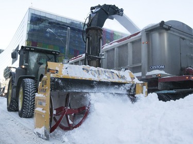 Massive city snowblower take care of the snow on Viger St. near the Palais des congrés on Sunday, Jan. 14, 2018.