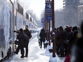 A woman boards a St-Jerome bound AMT train in January 2018.