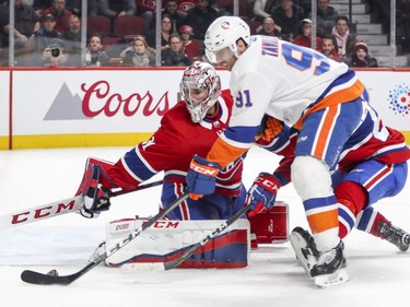 N.Y. Islanders John Tavares shoots the puck past Montreal Canadiens Carey Price for game-winning goal during overtime of National Hockey League game in Montreal Monday Jan. 15, 2018.