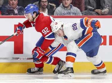 N.Y. Islanders Sebastian Aho tries to slow down Montreal Canadiens Jonathan Drouin during first period of National Hockey League game in Montreal Monday Jan. 15, 2018.