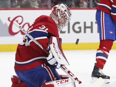 Montreal Canadiens Carey Price keeps his eyes on the puck while making a save during second period of National Hockey League game against the N.Y. Islanders in Montreal Monday Jan. 15, 2018.