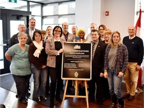 St-Lazare Mayor Robert Grimaudo and the Minister Responsible for Rehabilitation, Youth Protection, Public Health and Healthy Living and Member of Parliament for Soulanges, Lucie Charlebois, in company of some of the representatives of local non-profit organizations.