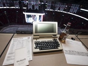 A memorial on Saturday, Jan. 20, 2018, with a bottle of Chivas is laid out where Red Fisher would watch and report on the games at the Bell Centre.