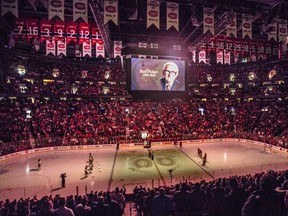 A moment of silence is held for Red Fisher at the start of the Canadiens game against the Boston Bruins at the Bell Centre on Saturday, Jan. 20, 2018.   (