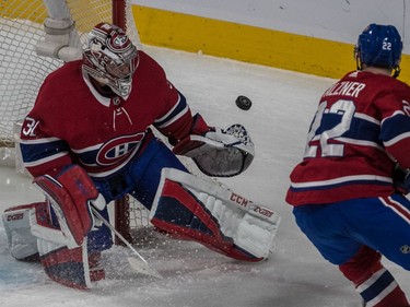 Montreal Canadiens defenceman Karl Alzner (22) watches teammate goaltender Carey Price (31) stop the puck during 1st period NHL action at the Bell Centre in Montreal, on Tuesday, Jan. 23, 2018.