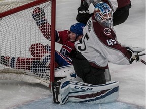 Montreal Canadiens right wing Brendan Gallagher (11) collides into the goal post behind Colorado Avalanche goaltender Jonathan Bernier (45) during 1st period NHL action at the Bell Centre in Montreal, on Tuesday, Jan. 23, 2018.