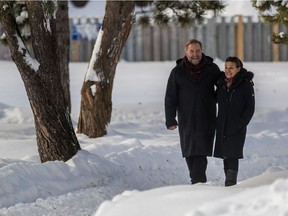 Former NDP leader Tom Mulcair walks with wife Catherine Pinhas, near the Beaconsfield Arena where he coached hockey for years.
