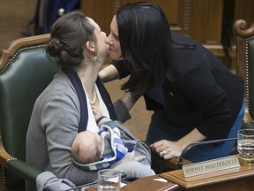 Montreal Mayor Valérie Plante, right, greets councillor Sophie Mauzerolle during council meeting on Wednesday, Jan. 24, 2018.