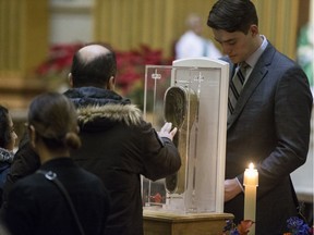 People line up to venerate the arm of St. Francis Xavier at Mary Queen of the World in downtown Montreal, January 28, 2018.