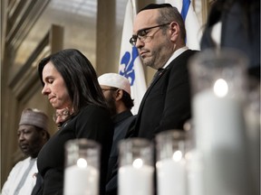 Montreal Mayor Valérie Plante observes a minute of silence at city hall during a ceremony Monday, Jan. 29, 2018 in honour of the victims of last year's attack on a Quebec City mosque.