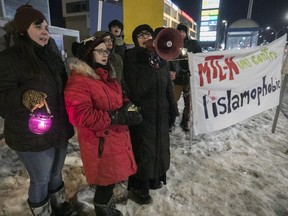 People attend a vigil against Islamophobia, on the corner of Henri-Bourassa and Lacordaire on Monday January 29, 2018. The vigil was to mark the one-year anniversary of the Quebec City mosque shooting.