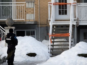 Montreal Police officer on the scene of an overnight homicide in Montreal on Monday, Jan. 29, 2018.