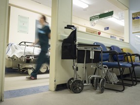 A nurses passes a waiting room on the S4 radiology ward in the S pavilion of the Royal Victoria Hospital, Wednesday, April 1, 2015.