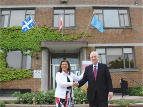 Mayor Paola Hawa and Liberal MP for Lac-St-Louis Francis Scarpaleggia shake hands in front of the Harpell Centre in Ste-Anne-de-Bellevue following a funding announcement in June, 2017.