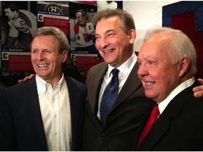Paul Henderson, left, who scored the winning goal in the 1972 Summit Series against the Soviets, is joined by goalie Vladislav Tretiak, centre, and Yvan Cournoyer at the Bell Centre in Montreal on Jan. 7, 2012.