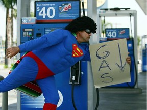 Norberto "Super Paisa" Gonzalez skates past gas pumps in California as part of a protest. Montreal doesn't have a gas-price superhero yet.