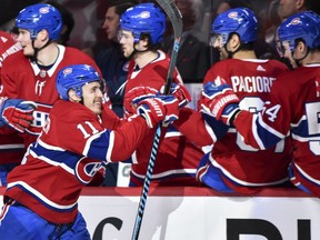 Canadiens' Brendan Gallagher (11) celebrates a third- period goal with teammates on the bench against the Vancouver Canucks at the Bell Centre on Sunday, Jan. 7, 2018, in Montreal.