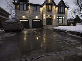 A heated driveway saves T.M.R. homeowner Ghassan Cordahi from having to shovel. The heated grate at the end of the driveway prevents the runoff from pooling and freezing on the road.