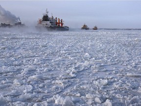 Cargo ships make their way down the ice-covered Saint Lawrence River December 28, 2017 at the Sorel-Tracy Ferry crossing in Sorel-Tracy, Quebec.