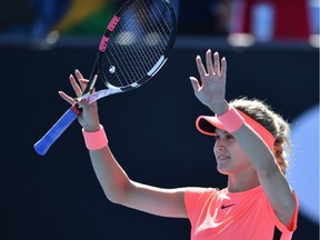 Canada's Eugenie Bouchard celebrates her victory against France's Oceane Dodin during their women's singles first round match on day two of the Australian Open tennis tournament in Melbourne on January 16, 2018.