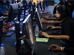 Visitors play computer games at the India Gaming Show South 2018 expo at the Bangalore International Exhibition Centre. The experts are hardly unanimous that "gaming disorder" even exists, writes Concordia University Public Scholar William Robinson.