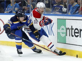 Canadiens' Brendan Gallagher and  Blues' Paul Stastny chase the puck along the boards Tuesday night in St. Louis