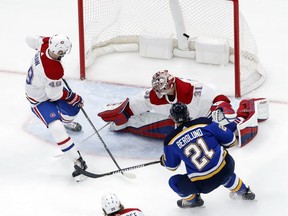 St. Louis Blues' Patrik Berglund scores past Montreal Canadiens goaltender Carey Price and Logan Shaw on Tuesday, Jan. 30, 2018, in St. Louis.