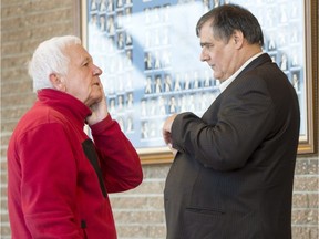 Jean Clusiault, left, father of victim Kathy Clusiault, chats with rail traffic controller Richard Labrie, as the jury deliberates for the fourth day on Sunday, Jan. 14, 2018, in Sherbrooke.