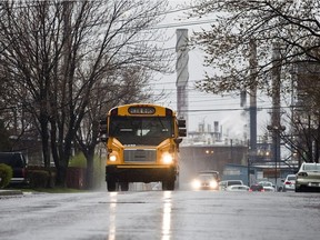 A school bus drives down 8th Ave. south of Sherbrooke St. E. in Montreal.