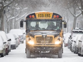 A school bus on a snowy road.