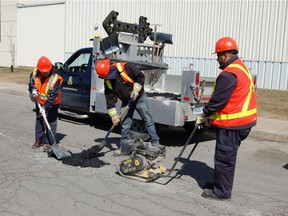 A road crew from Dorval Public Works repairs a pothole in 2013. (File photo courtesy of City of Dorval)