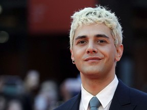 Actor and director Xavier Dolan poses for photos on the red carpet of the 12th edition of the Rome Film Fest, in Rome on Oct. 27, 2017.