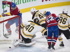 Canadiens' Max Pacioretty scores against Boston Bruins goaltender Tuukka Rask as Bruins' Matt Grzelcyk (48) Kevan Miller (86) and Canadiens' Artturi Lehkonen (62) look on in Montreal on Saturday, Jan. 13, 2018.
