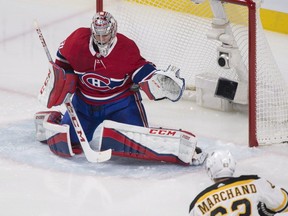 Montreal Canadiens goaltender Carey Price makes a save against Boston Bruins' Brad Marchand during first period NHL hockey action in Montreal, Saturday, January 13, 2018.