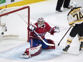 Boston Bruins' Jake DeBrusk scores on Canadiens goaltender Carey Price during second period action in Montreal on Saturday, Jan. 13, 2018.