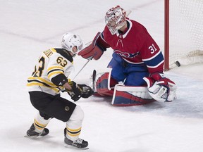 Boston Bruins' Brad Marchand scores on Canadiens goaltender Carey Price for the game-winning goal during the shootout in Montreal on Saturday, Jan. 13, 2018.