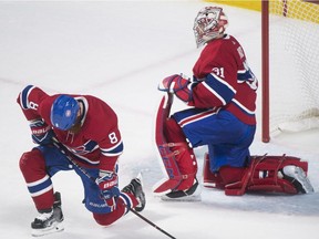 Canadiens goaltender Carey Price and defenceman Jordie Benn react after being scored on by Boston Bruins' David Pastrnak in Montreal on Saturday, Jan. 20, 2018.