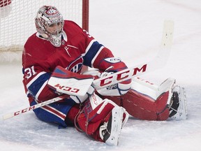 Montreal Canadiens goaltender Carey Pricesits in his crease after being scored on by Carolina Hurricanes centre Derek Ryan during second period NHL hockey action in Montreal on Thursday, January 25, 2018.