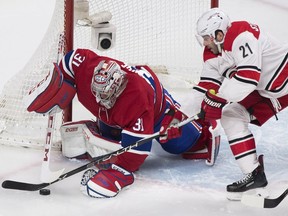 Carolina Hurricanes right wing Lee Stempniak (21) moves in on Montreal Canadiens goaltender Carey Price (31) during second period NHL hockey action in Montreal, Thursday, January 25, 2018.