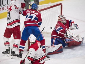 Montreal Canadiens goaltender Carey Price (31) is scored on by Carolina Hurricanes centre Derek Ryan (7) as left wing Jeff Skinner (53) and Canadiens left wing Alex Galchenyuk (27) look for the rebound during second period NHL hockey action in Montreal, Thursday, January 25, 2018.